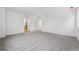 Large bonus room with neutral carpet flooring, a doorway, and natural light at 9297 Truckee Ct, Commerce City, CO 80022