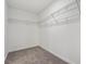 Bright walk-in closet features neutral walls, gray carpeting, and metal shelving for optimal storage at 9297 Truckee Ct, Commerce City, CO 80022