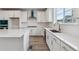 Well-lit kitchen with island, stainless steel appliances, and sleek countertops at 9297 Truckee Ct, Commerce City, CO 80022