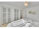 Light, bright bedroom with and closets and a chandelier at 7018 Reed Ct, Arvada, CO 80003