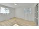 Bedroom with hardwood floors, great natural light, and closet at 7018 Reed Ct, Arvada, CO 80003