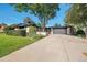 Charming brick home featuring a well-maintained front yard, mature trees, and a spacious driveway at 7018 Reed Ct, Arvada, CO 80003