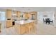 Bright kitchen with a large island, stainless steel appliances, and sleek countertops perfect for cooking at 7018 Reed Ct, Arvada, CO 80003
