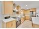 Well-equipped kitchen features modern appliances, ample counter space, and plenty of storage at 7018 Reed Ct, Arvada, CO 80003