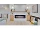 Modern fireplace with custom built-ins, and updated lighting at 7018 Reed Ct, Arvada, CO 80003