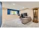 Finished basement with neutral carpet, modern desk, and window providing natural light at 7863 W Friend Dr, Littleton, CO 80128