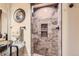Beautiful bathroom features a seamless glass shower and modern finishes at 7863 W Friend Dr, Littleton, CO 80128
