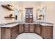 The dual vanity features granite counters, custom cabinetry, pendant lights, and mirrors at 7863 W Friend Dr, Littleton, CO 80128