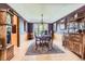 Formal dining room with hardwood floors, elegant lighting, and classic decor at 7863 W Friend Dr, Littleton, CO 80128