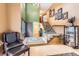 Spacious foyer featuring hardwood floors, a staircase, and warm paint tones at 7863 W Friend Dr, Littleton, CO 80128