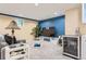 The living room features bright accent walls, a mini bar, recessed lighting, and carpeted floors at 7863 W Friend Dr, Littleton, CO 80128