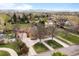 Aerial view showcasing the home's setting among mature trees in a well-established neighborhood at 435 Balsam St, Lakewood, CO 80226