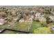 Aerial view of the property showcasing its layout, including the house, outbuildings, and spacious yard at 435 Balsam St, Lakewood, CO 80226