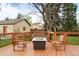Back deck features a fire pit with seating area and views of the backyard at 435 Balsam St, Lakewood, CO 80226