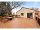 Wooden back deck with seating area and built-in firepit, perfect for entertaining at 435 Balsam St, Lakewood, CO 80226