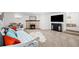 Finished basement boasts a cozy fireplace, media center, and comfortable seating at 435 Balsam St, Lakewood, CO 80226