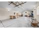 Spacious basement with work tables and natural light from the windows at 435 Balsam St, Lakewood, CO 80226