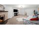Finished basement with a fireplace, media center, and flexible living space at 435 Balsam St, Lakewood, CO 80226