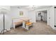 Finished basement with built in bench seating, an eating area and new carpet, perfect for entertaining or relaxing at 435 Balsam St, Lakewood, CO 80226