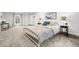 Bright bedroom features neutral carpet and a large window for natural light at 435 Balsam St, Lakewood, CO 80226