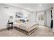 Bedroom featuring neutral carpet, natural lighting, and minimalist design elements at 435 Balsam St, Lakewood, CO 80226