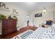 Cozy bedroom with hardwood floors, decorative shelves, and a unique swing chair at 435 Balsam St, Lakewood, CO 80226