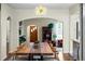 Warm dining room showcasing an open floor plan and a large wooden table with seating for six at 435 Balsam St, Lakewood, CO 80226