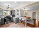 Open kitchen with gray cabinets, a breakfast bar with seating, and view to a dining room at 435 Balsam St, Lakewood, CO 80226