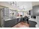 Spacious, updated kitchen featuring gray cabinets, a large window, and stainless steel appliances at 435 Balsam St, Lakewood, CO 80226