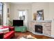 Inviting living room features a decorative fireplace, hardwood floors, and a cozy ambiance at 435 Balsam St, Lakewood, CO 80226