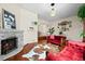 Stylish living room with a fireplace, hardwood floors, and an open layout, perfect for entertaining at 435 Balsam St, Lakewood, CO 80226