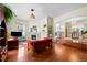 Living room with hardwood floors, fireplace, and an open flow to the dining area creating an inviting living space at 435 Balsam St, Lakewood, CO 80226