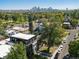 Aerial view of the home with Denver skyline in the background at 4432 Umatilla St, Denver, CO 80211