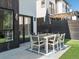 Backyard features a table with seating for eight plus artificial turf at 4432 Umatilla St, Denver, CO 80211
