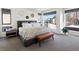 Serene bedroom with neutral tones, large windows, and a comfortable bed, creating a relaxing atmosphere at 4432 Umatilla St, Denver, CO 80211