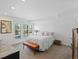 Inviting bedroom showcasing neutral tones, plush carpet, shutters and comfortable furnishings at 4432 Umatilla St, Denver, CO 80211