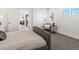 Bright bedroom boasts a neutral palette, shutters, a chair, and a small accent table at 4432 Umatilla St, Denver, CO 80211