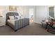 Cozy bedroom with plush bed, matching nightstands, and window views at 4432 Umatilla St, Denver, CO 80211
