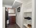 Neat closet space featuring built in shelving, drawers and mirror at 4432 Umatilla St, Denver, CO 80211