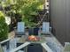 Cozy backyard fire pit with Adirondack chairs, perfect for enjoying outdoor evenings at 4432 Umatilla St, Denver, CO 80211