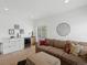 Comfortable living room featuring wet bar, mini fridge, and stylish furnishings at 4432 Umatilla St, Denver, CO 80211