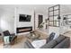Comfortable living room with sleek fireplace, modern decor, and plush seating arrangement around a glass coffee table at 4432 Umatilla St, Denver, CO 80211