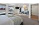 Spacious main bedroom with a raised sitting area, modern furniture, and ample natural light at 4432 Umatilla St, Denver, CO 80211