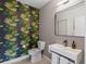Stylish powder room featuring bold wallpaper, modern fixtures, and clean lines for a contemporary feel at 4432 Umatilla St, Denver, CO 80211