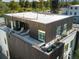 Inviting rooftop deck featuring lounge chairs and stylish planters, perfect for outdoor relaxation at 4432 Umatilla St, Denver, CO 80211