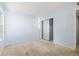 Light-filled bedroom with a closet and neutral walls, plus carpet flooring at 1929 S Xanadu Way, Aurora, CO 80014