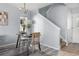 Cozy dining area featuring modern flooring, neutral walls, and a view of the staircase at 1929 S Xanadu Way, Aurora, CO 80014