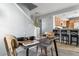 Elegant dining area leads to the kitchen with bar seating, perfect for casual dining at 1929 S Xanadu Way, Aurora, CO 80014