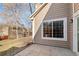 A tan home with a patio and tree visible through a large window at 1929 S Xanadu Way, Aurora, CO 80014