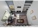 Aerial view of living room with fireplace, shelving, and sunlight at 1929 S Xanadu Way, Aurora, CO 80014